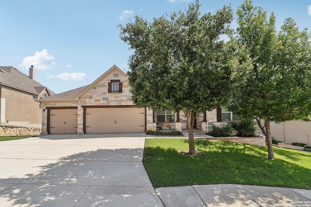 28534 Tristant Rdg, San Antonio, TX 78260 - view of front facade with stone siding, driveway, a garage, and a front yard