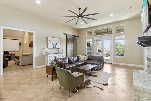 28534 Tristant Rdg, San Antonio, TX 78260 - living room with ceiling fan, light tile patterned floors, a fireplace, recessed lighting, and baseboards