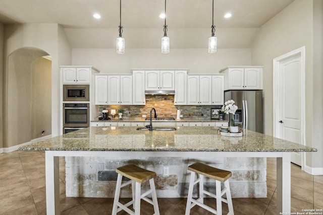 28534 Tristant Rdg, San Antonio, TX 78260 - kitchen featuring appliances with stainless steel finishes, a sink, backsplash, white cabinets, and recessed lighting