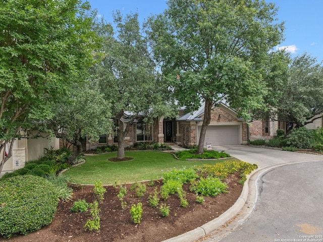126 Calais Way, Shavano Park, TX 78249 - obstructed view of property featuring an attached garage, driveway, brick siding, and a front lawn