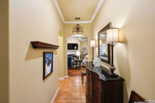 126 Calais Way, Shavano Park, TX 78249 - corridor featuring light tile patterned floors, ornamental molding, baseboards, and arched walkways