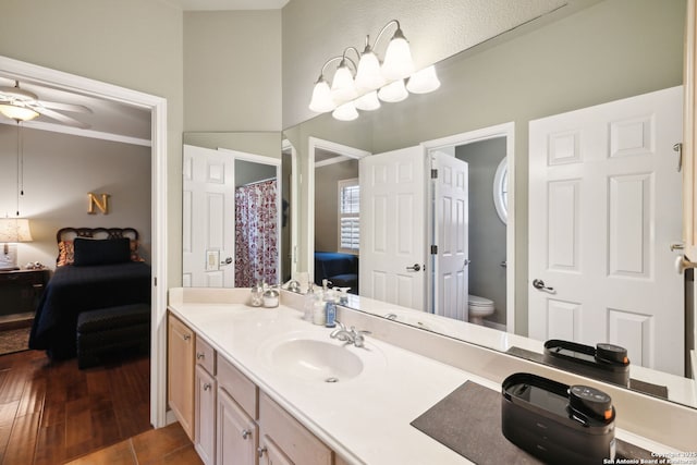 126 Calais Way, Shavano Park, TX 78249 - ensuite bathroom with toilet, vanity, ceiling fan, and wood finished floors