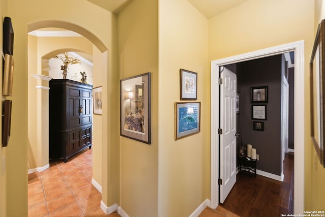 126 Calais Way, Shavano Park, TX 78249 - hallway featuring arched walkways, baseboards, and light tile patterned floors