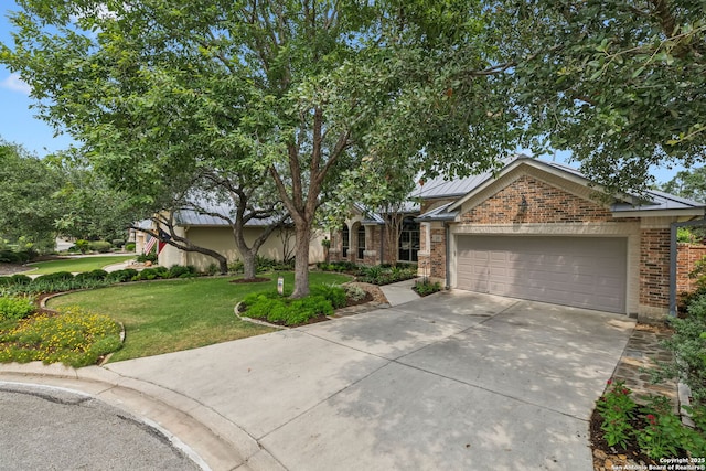 126 Calais Way, Shavano Park, TX 78249 - view of front of property featuring brick siding, concrete driveway, a front lawn, an attached garage, and a standing seam roof