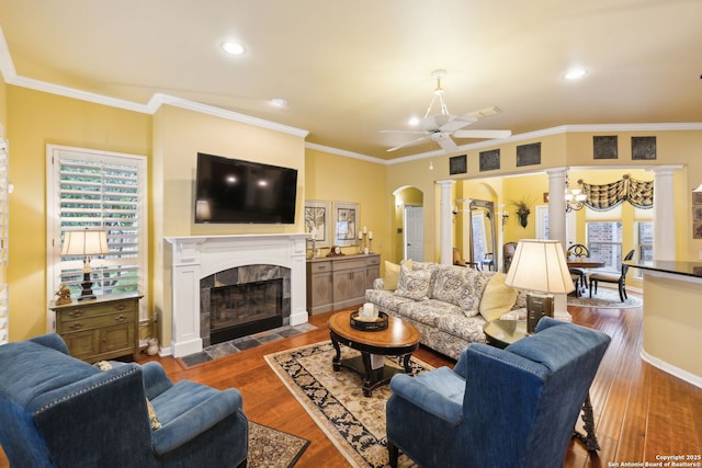126 Calais Way, Shavano Park, TX 78249 - living room featuring ornate columns, wood finished floors, a ceiling fan, a tile fireplace, and crown molding