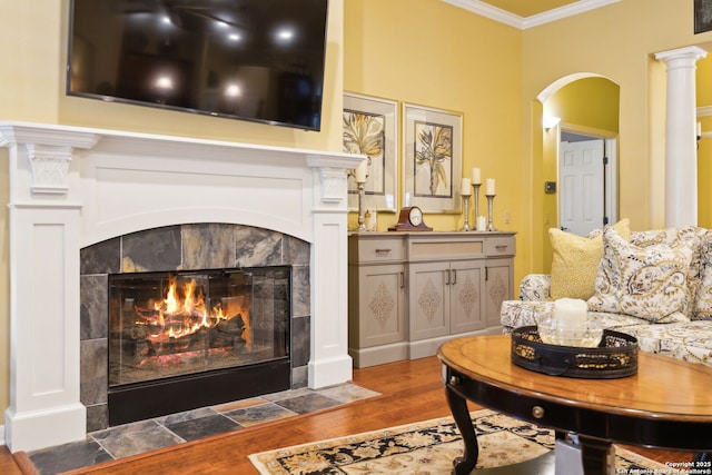 126 Calais Way, Shavano Park, TX 78249 - living area with wood finished floors, crown molding, a tile fireplace, and arched walkways