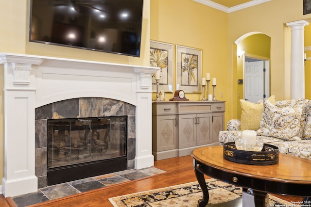 126 Calais Way, Shavano Park, TX 78249 - living area with a tile fireplace, crown molding, wood finished floors, and arched walkways