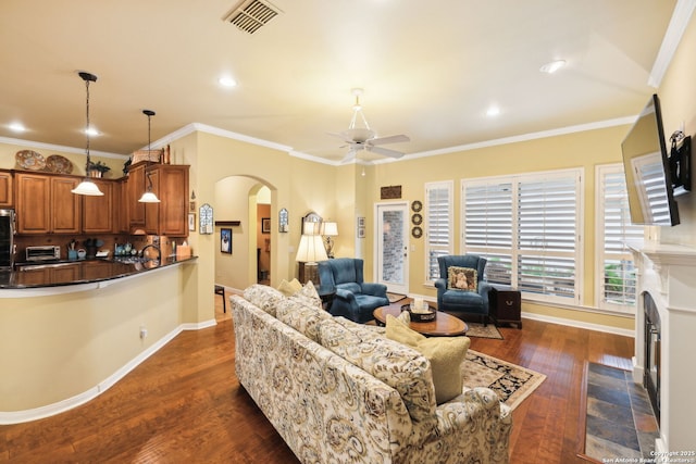 126 Calais Way, Shavano Park, TX 78249 - living room with arched walkways, ceiling fan, dark wood finished floors, baseboards, and ornamental molding