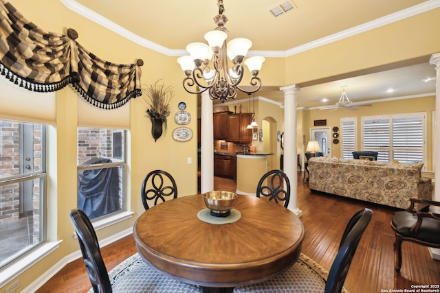 126 Calais Way, Shavano Park, TX 78249 - dining room with ornate columns, ceiling fan, dark wood finished floors, crown molding, and a chandelier
