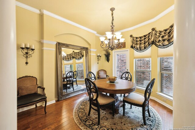 126 Calais Way, Shavano Park, TX 78249 - dining area with a chandelier, crown molding, dark wood-style floors, and baseboards