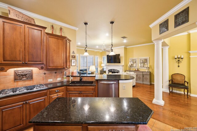 126 Calais Way, Shavano Park, TX 78249 - kitchen with a sink, appliances with stainless steel finishes, open floor plan, a peninsula, and ornate columns