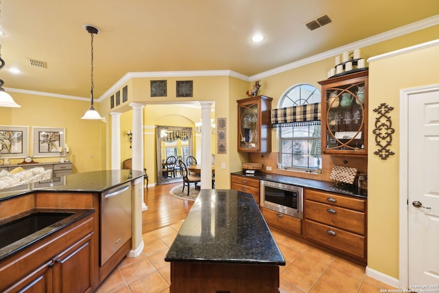 126 Calais Way, Shavano Park, TX 78249 - kitchen with decorative columns, appliances with stainless steel finishes, glass insert cabinets, dark stone counters, and ornamental molding