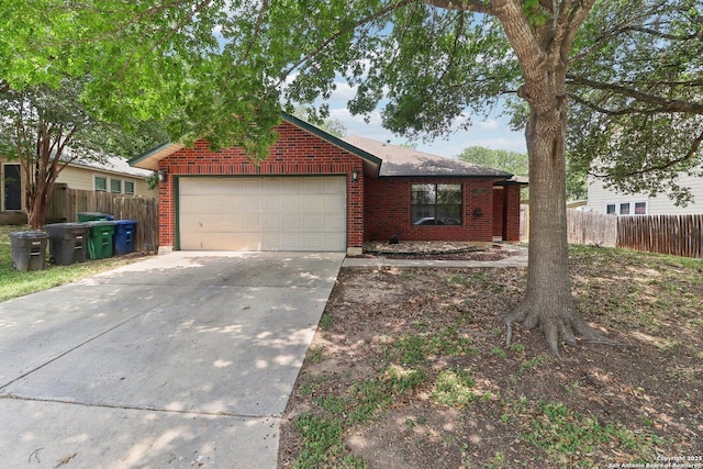6831 Raintree Path, San Antonio, TX 78233 - view of front of house featuring a garage, driveway, and brick siding