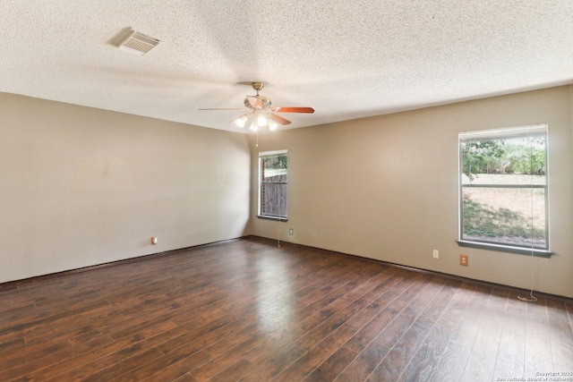 6831 Raintree Path, San Antonio, TX 78233 - unfurnished room featuring ceiling fan, healthy amount of natural light, dark wood-style flooring, and a textured ceiling