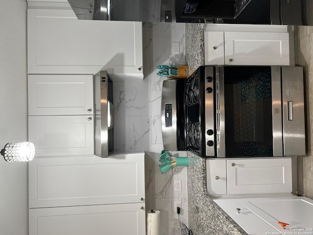 112 Agave Cir, Jourdanton, TX 78026 - kitchen with white cabinets