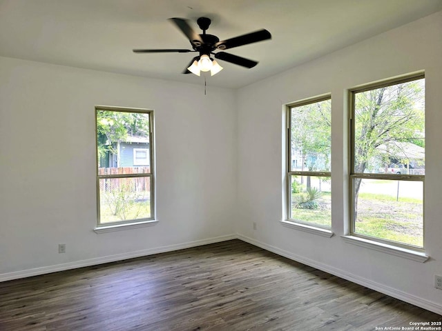 911 Florida, San Antonio, TX 78210 - unfurnished room featuring dark wood finished floors, ceiling fan, and baseboards
