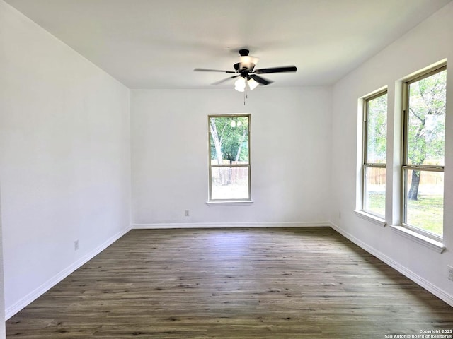 911 Florida, San Antonio, TX 78210 - spare room featuring plenty of natural light, dark wood finished floors, a ceiling fan, and baseboards