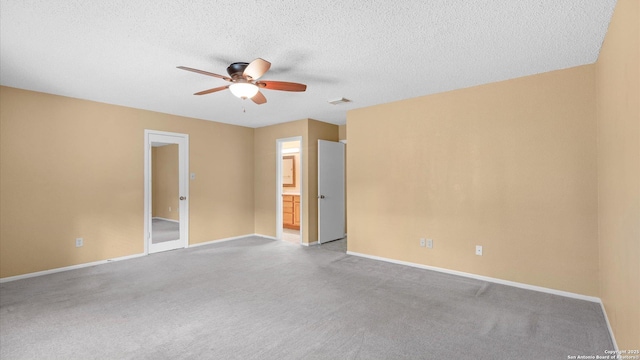 4714 Irish Elm, San Antonio, TX 78247 - unfurnished room featuring a ceiling fan, baseboards, light colored carpet, and a textured ceiling