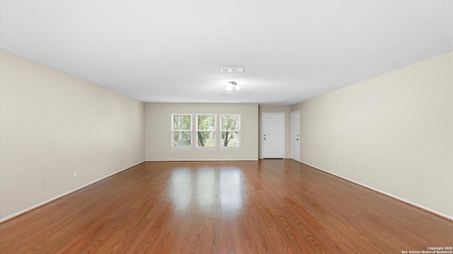 4714 Irish Elm, San Antonio, TX 78247 - spare room featuring wood finished floors and baseboards