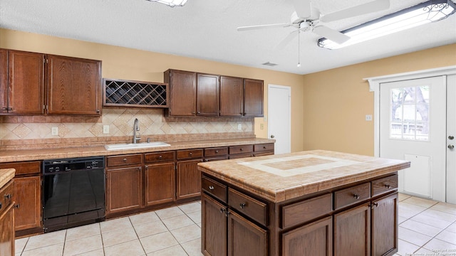 4714 Irish Elm, San Antonio, TX 78247 - kitchen featuring dishwasher, a sink, decorative backsplash, light tile patterned flooring, and a ceiling fan
