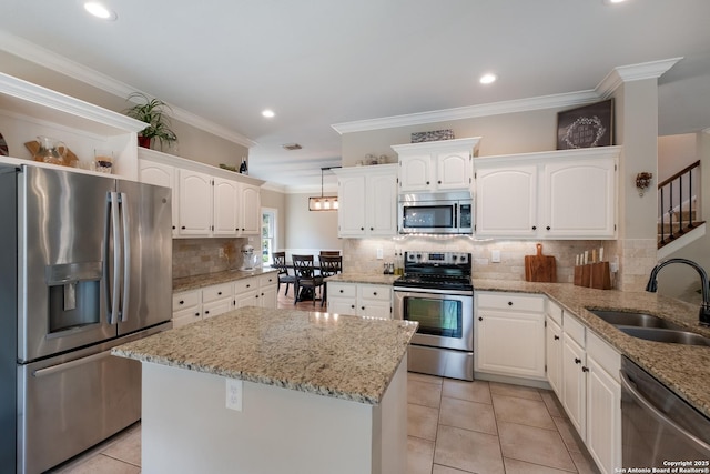 13314 Galicia, Universal City, TX 78148 - kitchen featuring stainless steel appliances, a sink, white cabinetry, crown molding, and light tile patterned floors