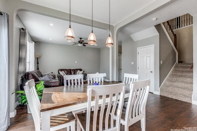 7719 Proton Smt, San Antonio, TX 78252 - dining space featuring ceiling fan, wood finished floors, stairway, arched walkways, and recessed lighting