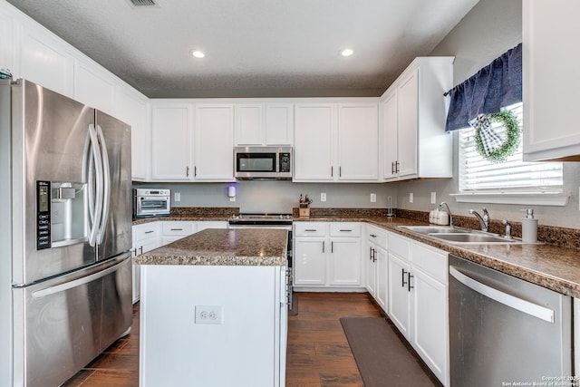 7719 Proton Smt, San Antonio, TX 78252 - kitchen featuring appliances with stainless steel finishes, dark wood finished floors, a center island, a sink, and recessed lighting