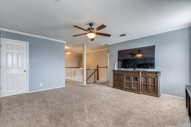 7719 Proton Smt, San Antonio, TX 78252 - unfurnished living room with ceiling fan, ornamental molding, carpet flooring, baseboards, and a textured ceiling