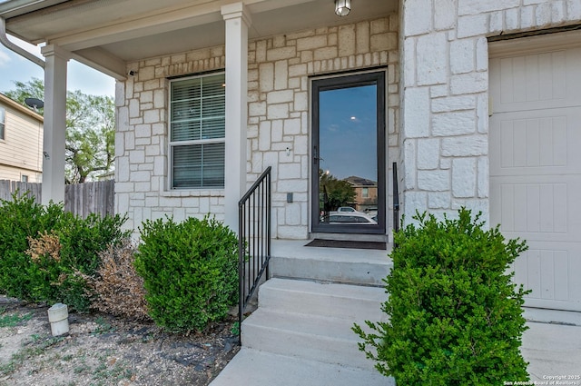 7719 Proton Smt, San Antonio, TX 78252 - property entrance with stone siding and a porch