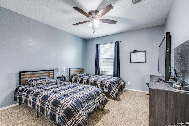 7719 Proton Smt, San Antonio, TX 78252 - bedroom with a textured wall, carpet floors, baseboards, a textured ceiling, and ceiling fan