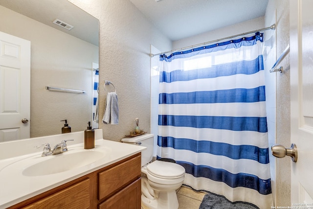 7719 Proton Smt, San Antonio, TX 78252 - bathroom with a textured wall, vanity, toilet, tile patterned flooring, and a shower with curtain