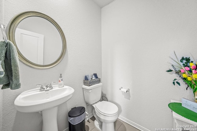 7526 Boxing Elm, San Antonio, TX 78244 - half bath with toilet, tile patterned floors, and baseboards