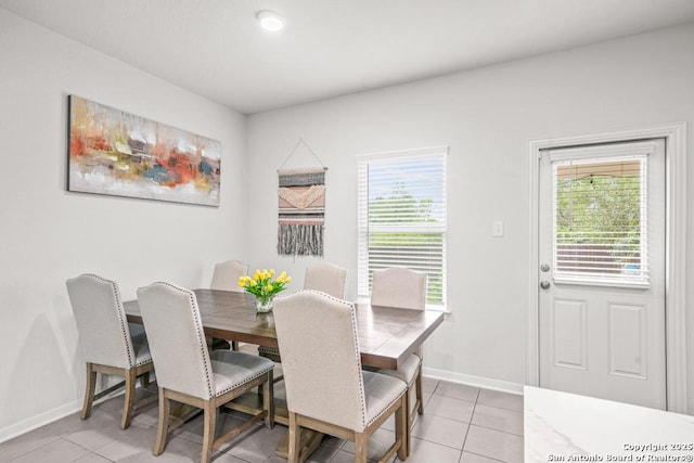 7526 Boxing Elm, San Antonio, TX 78244 - dining area featuring light tile patterned floors, healthy amount of natural light, and baseboards