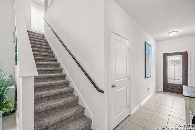 7526 Boxing Elm, San Antonio, TX 78244 - foyer entrance featuring stairs, light tile patterned floors, and baseboards