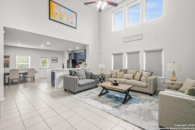 7526 Boxing Elm, San Antonio, TX 78244 - living area with ceiling fan, light tile patterned flooring, a towering ceiling, baseboards, and recessed lighting