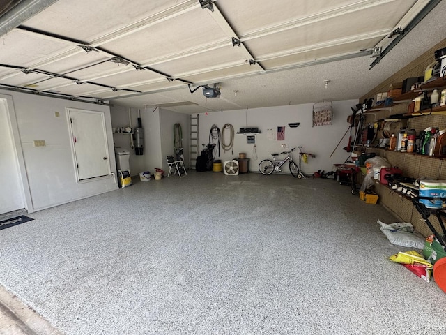 1839 Shoal Run, San Antonio, TX 78232 - garage with a garage door opener and a central vacuum unit