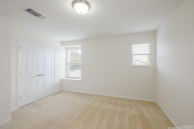 6015 Wisteria Hl, San Antonio, TX 78218 - unfurnished bedroom featuring carpet flooring, baseboards, and a closet