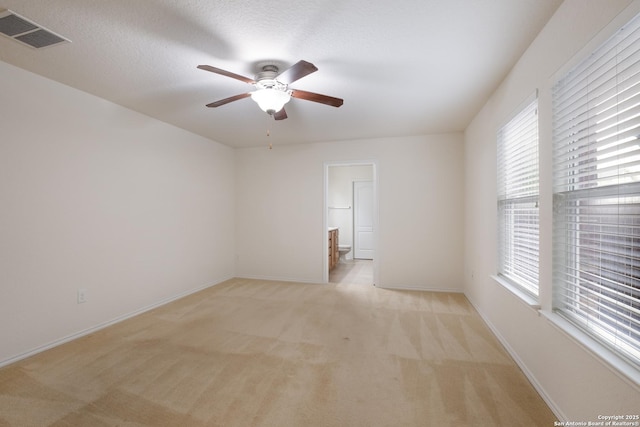 6015 Wisteria Hl, San Antonio, TX 78218 - spare room with ceiling fan, light carpet, and baseboards