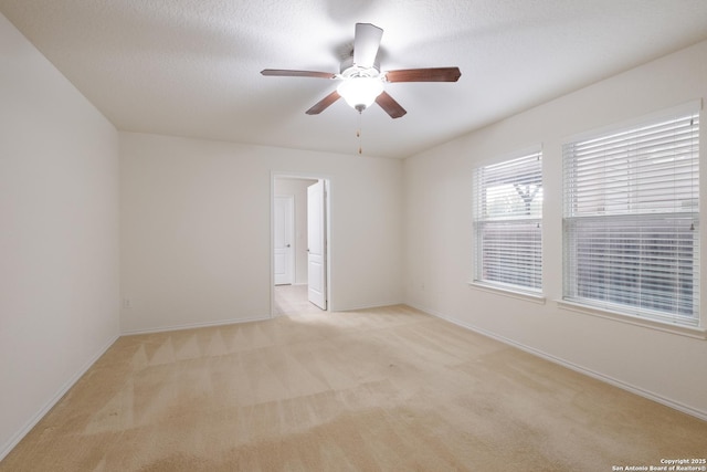 6015 Wisteria Hl, San Antonio, TX 78218 - unfurnished room featuring light colored carpet, ceiling fan, and baseboards