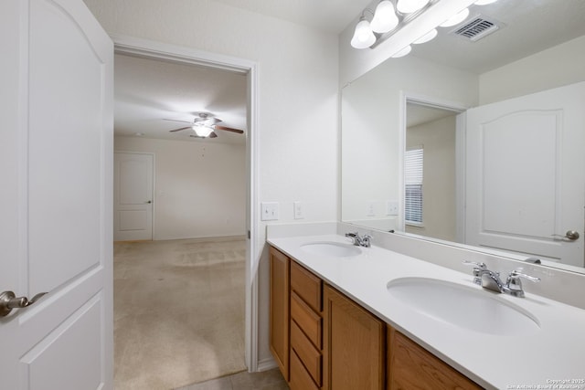 6015 Wisteria Hl, San Antonio, TX 78218 - bathroom featuring ceiling fan and double vanity