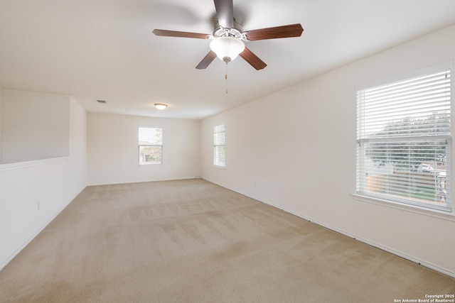 6015 Wisteria Hl, San Antonio, TX 78218 - unfurnished room featuring light colored carpet, a ceiling fan, and baseboards
