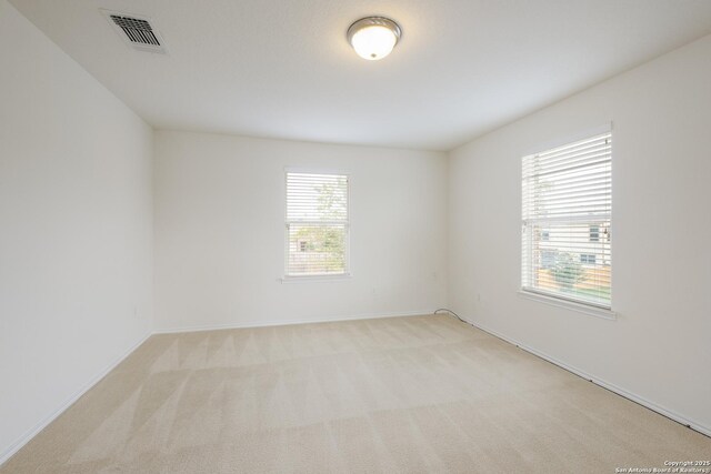 6015 Wisteria Hl, San Antonio, TX 78218 - empty room featuring plenty of natural light, carpet, and baseboards