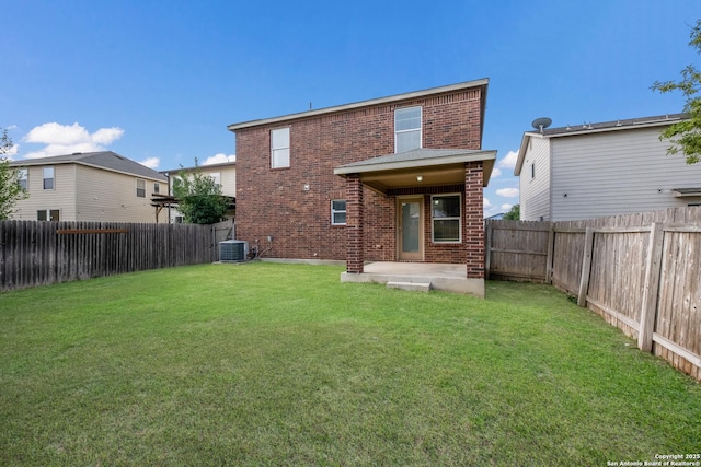 6015 Wisteria Hl, San Antonio, TX 78218 - rear view of house featuring brick siding, central AC, and a patio