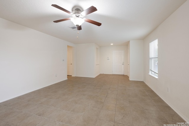 6015 Wisteria Hl, San Antonio, TX 78218 - unfurnished room featuring ceiling fan, baseboards, light tile patterned floors, and recessed lighting