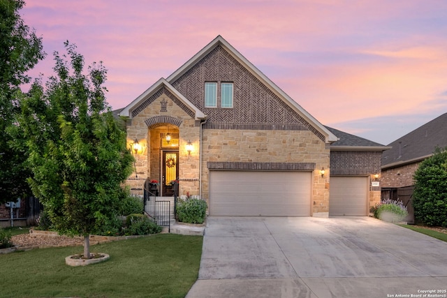 28906 Gracies Sky, San Antonio, TX 78260 - french country inspired facade featuring stone siding, concrete driveway, an attached garage, and brick siding