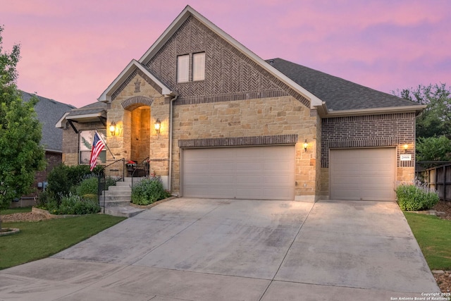 28906 Gracies Sky, San Antonio, TX 78260 - french provincial home with concrete driveway, an attached garage, stone siding, and roof with shingles