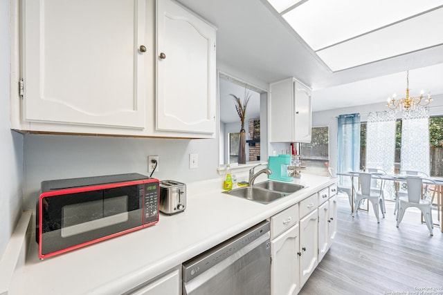 6718 Country Fld, San Antonio, TX 78240 - kitchen with dishwasher, a sink, white cabinets, and a chandelier