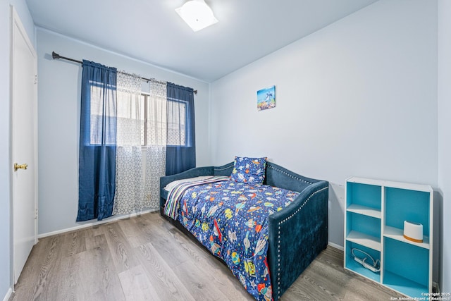 6718 Country Fld, San Antonio, TX 78240 - bedroom featuring wood finished floors and baseboards