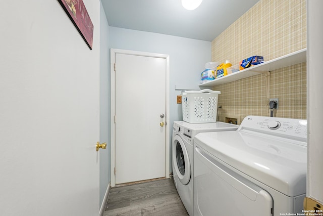 6718 Country Fld, San Antonio, TX 78240 - washroom with washer and dryer and light wood-style floors