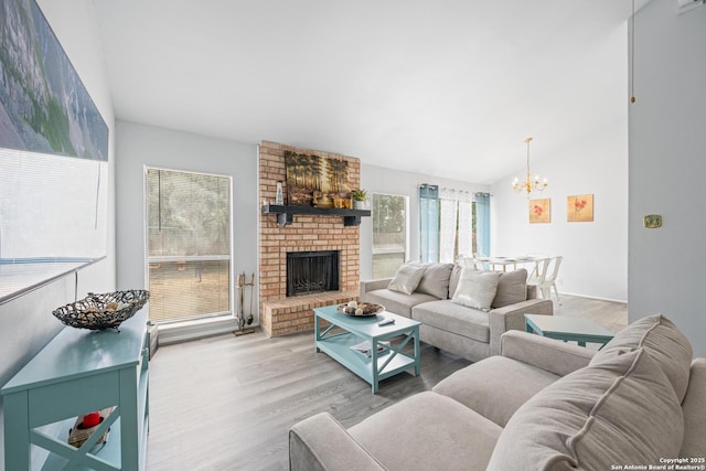 6718 Country Fld, San Antonio, TX 78240 - living area featuring a chandelier, lofted ceiling, wood finished floors, and a brick fireplace